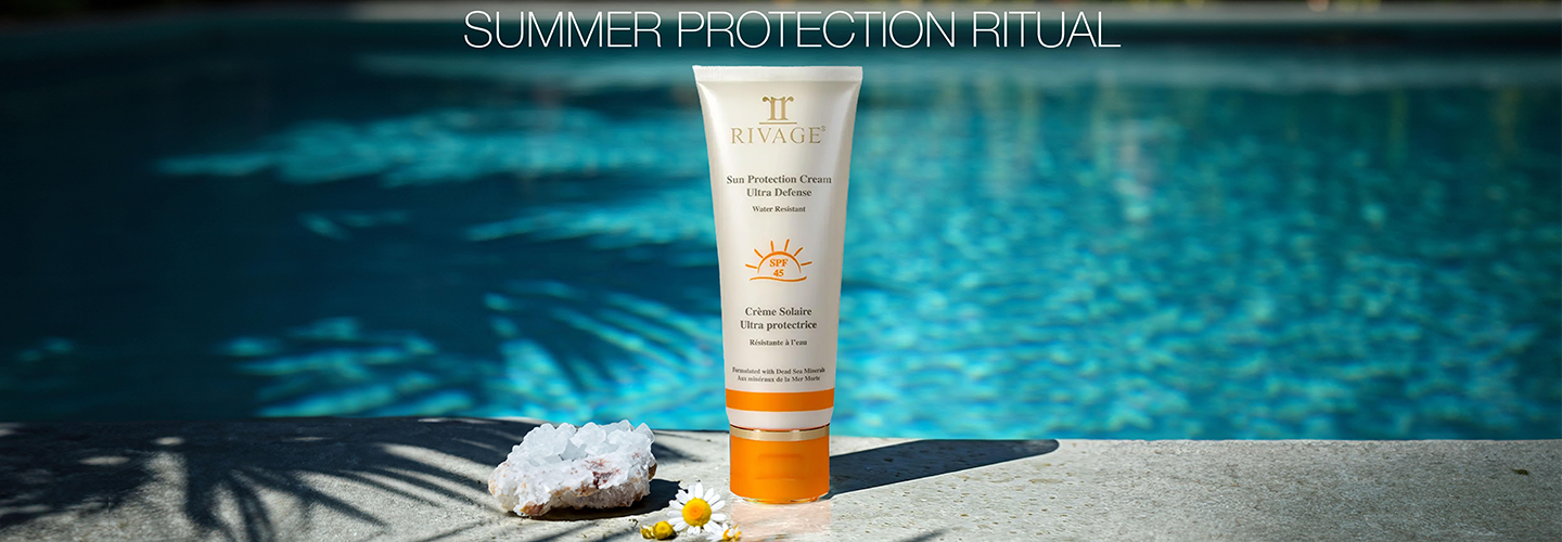 Tube of Rivage Sun Protection Cream SPF 45 on pool side for the best summer protection